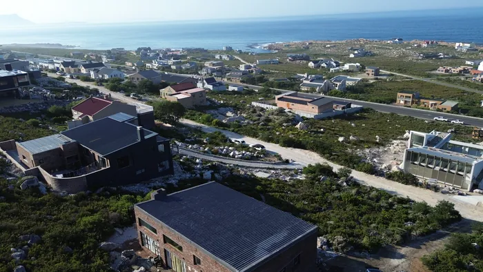 Betty's Bay laid out below the site, the village and the sea beyond it
