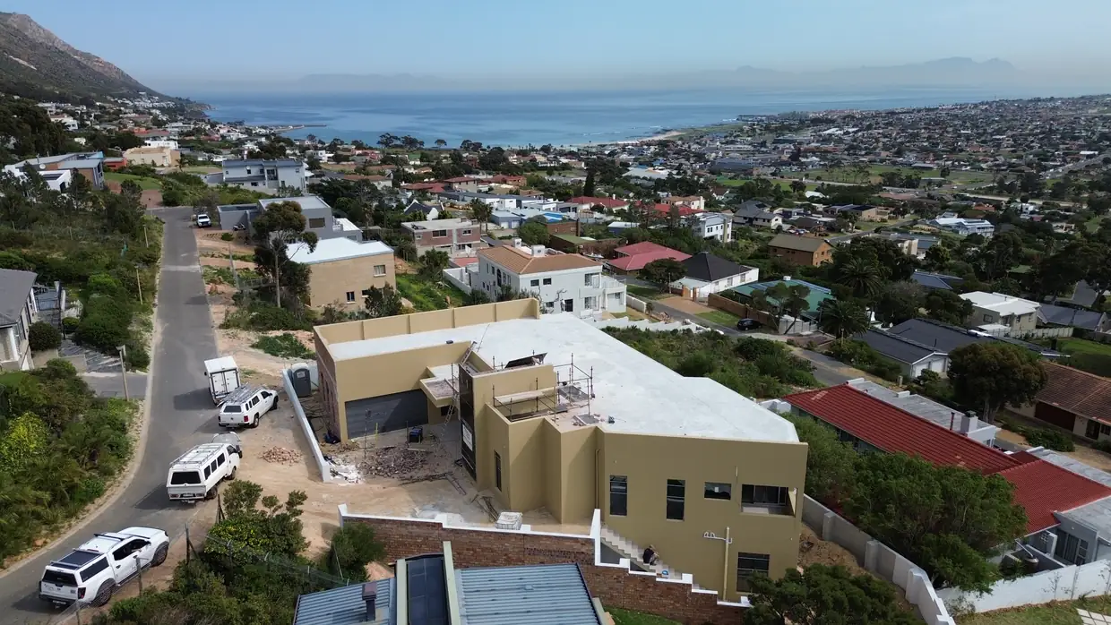 House Makhene on the Gordon's Bay mountainside, seen from above with False Bay stretching out behind it
