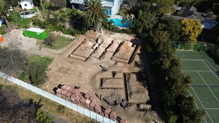 Trenches and foundation brickwork set out for three houses in July 2025